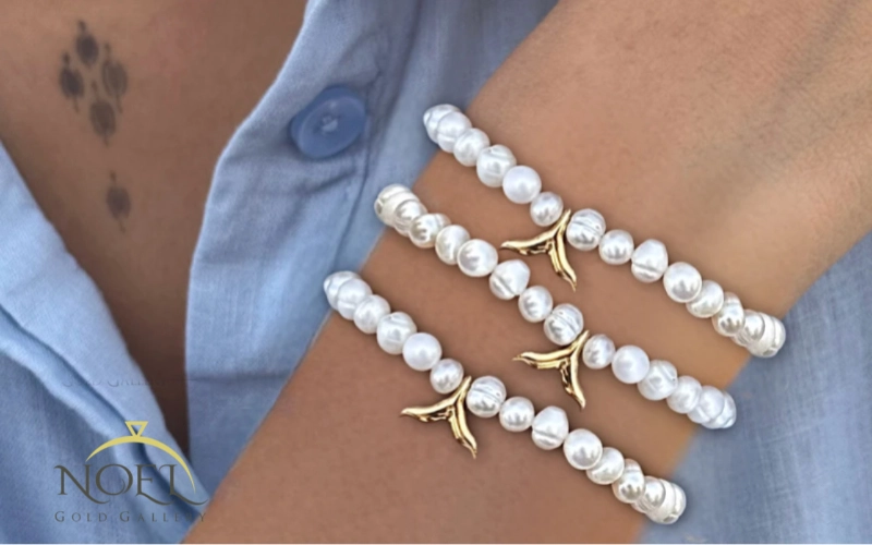 دستبند مرواریدی با پلاک دم نهنگ کد 100134